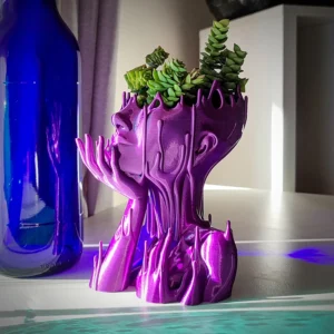 Add personality to your garden or tabletop with the Casaroja MELTED GIRL Planter. Featuring a whimsical melted figure design, this durable resin pot has drainage holes to keep plants healthy while serving as a decorative piece.